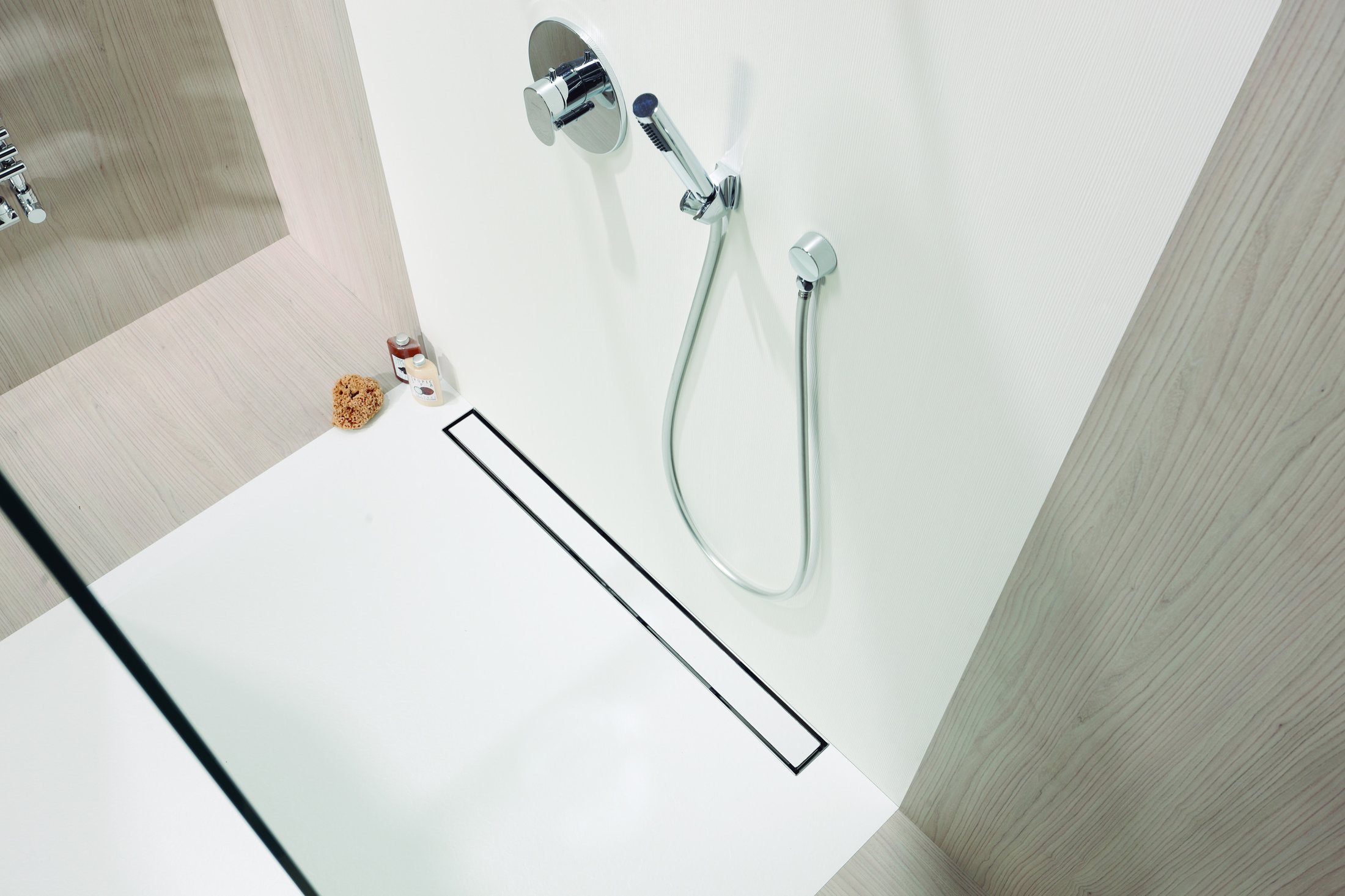 Fillable shower channel set flush in a tiled shower floor