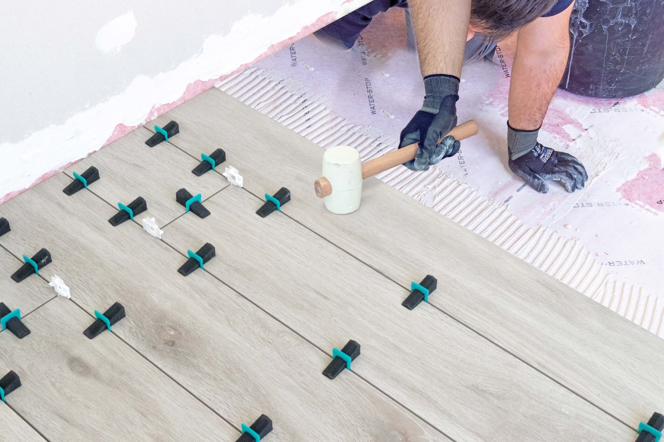 Large format flooring with the levelling system fitted in every joint